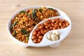 South indian spicy crunchy mix Nimco or Namkeen and spicy coated peanut white bowl wooden background