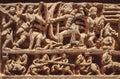 South Indian temple relief with battle scene. warriors on wall of Hindu structure from 12th century, Halebidu, India
