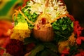 South Indian thaali wrapped around coconut and decorated with garland as per tradition.