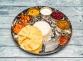 south indian vegetarian meal thali vegetables, curry, rice, raita, korma, kesari halwa and chapati served in dish isolated on Royalty Free Stock Photo