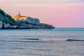 South italy background of Vieste church village at sunset by the sea with purple sky Royalty Free Stock Photo