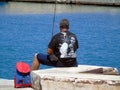 Fisherman in action with fishing rod