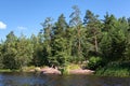 South Karelia lake of the Saimaa Canal , Russian wild nature. Stone rock shore of a forest lake. Scandinavian landscape. Russia. Royalty Free Stock Photo