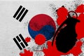 South Korea flag and MK2 frag grenade in red blood. Concept for terror attack or military operations with lethal outcome