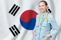 South Korea healthcare concept with doctor on flag background. Medical insurance, work or study in the country