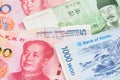 South Korea Won and China Yuan Renminbi currency banknotes.