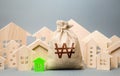 South korean won money bag and a city of house figures. City municipal budget. Buying real estate, fair price. Investments