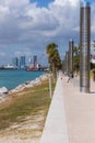 South Point Park in Miami Beach skyline buildings ocean view people at a distance social distancing on a sunny day walking Royalty Free Stock Photo