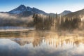 South Sister and Broken Top reflect over the calm waters of Sparks Lake at sunrise in the Cascades Range in Central Oregon, USA in Royalty Free Stock Photo