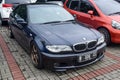 Black BMW 330ci E46 coupe on parking lot