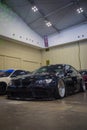 Modified black BMW 335i coupe E92 in The Elite showcase