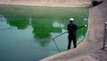 A male cleans the reservoir artificial lake from plastic wasteÃ¢â¬Â¤