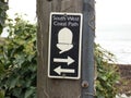 South west Coast Path Acorn Sign with arrows Royalty Free Stock Photo