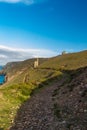 South west coast path and Towanroath shaft Engine House. Royalty Free Stock Photo