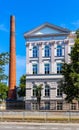 South wing of historic building of Warsaw Polytechnics technical university with vintage chimney in Warsaw, Poland