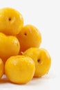 Southafrican yellow plums on white background