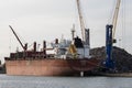 Scrap metal stacked on wharf ready for exporting