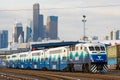 Southbound Sounder Train leaving Seattle with the skyline behind
