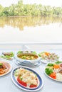 Southeast Asian cuisine set, Japanese shrimps with salad, Fish organs sour soup Thai style, Fish sauce Southern style, fried Royalty Free Stock Photo