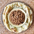 Southeast Asian, Indian or Myanmar traditional breakfast, cooked yellow peas and naan bread or nan bya.