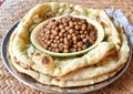 Southeast Asian, Indian or Myanmar traditional breakfast, cooked yellow peas and naan bread or nan bya.