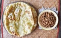 Southeast Asian, Indian or Myanmar traditional breakfast, cooked yellow peas and naan bread or nan bya.