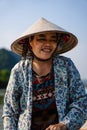 Southeast Asian woman paddling a boat to Thien Tru Temple and the Perfume Pagoda in Hanoi, Vietnam Royalty Free Stock Photo
