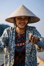 Southeast Asian woman paddling a boat to Thien Tru Temple and the Perfume Pagoda in Hanoi, Vietnam Royalty Free Stock Photo