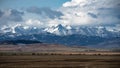 Southern Alberta mountains and praries with hay bales. Royalty Free Stock Photo