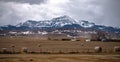 Southern Alberta mountains and praries with hay bales. Royalty Free Stock Photo