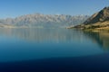 Southern Alps reflecting in lake Hawea Royalty Free Stock Photo