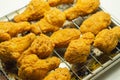 Southern crispy battered fried chicken wings, deep-fried chicken wings on the metal tray Royalty Free Stock Photo