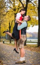 Bavarian couple in Tracht in loving embrace with uplift Royalty Free Stock Photo