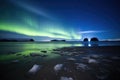 southern lights illuminating a deserted frozen beach