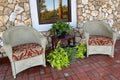 southern style cobblestone porch chairs Royalty Free Stock Photo