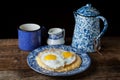 Southern style grits served with two sunny side fried eggs