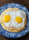 Southern style grits served with two sunny side fried eggs