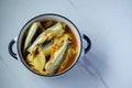 Southern Thai Spicy Sour Yellow Curry with pickled bamboo shoots in a white pot. Local Thai food