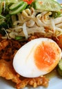 Southern of Thailand salad included of boiled egg, fried prawn, rice vermicelli, cucumber, morning glory, bean sprouts and sauce Royalty Free Stock Photo