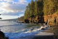 Vancouver Island Evening Light on Pebble Beach and Coastal Waterfall near Sombrio Point, Juan de Fuca, British Columbia, Canada Royalty Free Stock Photo