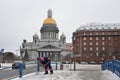 The southerner janitor cleans snow near the St. Isaac's Cathedra Royalty Free Stock Photo