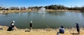 Panoramic community fishing event at neighborhood pond during sunny Spring day in Southlake, Texas, USA