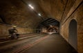 Southwark, London, UK: Bermondsey Street passing through a road tunnel with cyclist and pedestrians