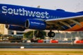 Southwest Airlines airplane landing on runway