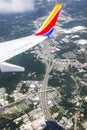 Southwest Airlines Airplane wing overlooking freeway Royalty Free Stock Photo