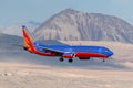 Southwest Airlines Boeing 737 airliner on approach to land at McCarran International Airport in Las Vegas at night