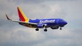 Southwest Airlines Boeing 737 flying over the Chicago O'Hare International Airport runway Royalty Free Stock Photo