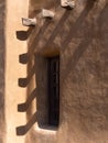 Southwestern architecture, window in adobe wall Royalty Free Stock Photo