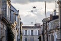 Selective blur on Facades of typical old French residential buildings in Bordeaux, France, made of freestone, hosting flats Royalty Free Stock Photo