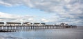 Southwold`s iconic pier against a dramatic sky in Southwold, Suffolk, UK